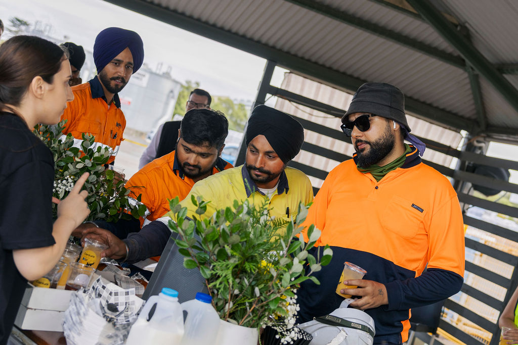 Four people looking at their drink